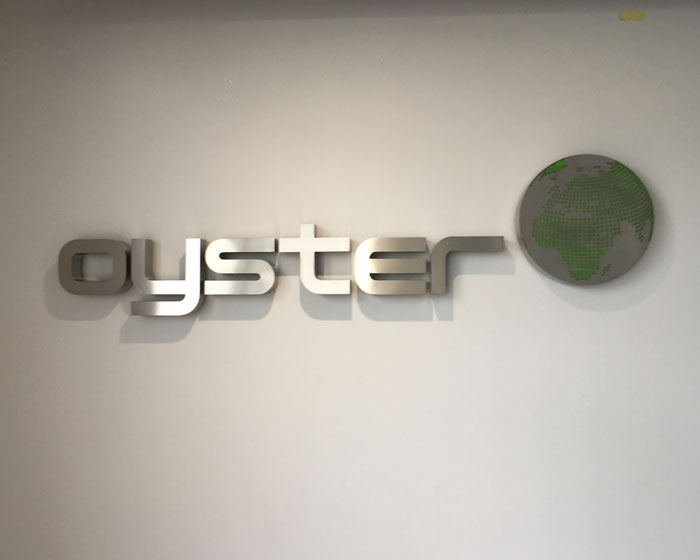 Brushed stainless built up metal lettering for Oyster financial in Hythe